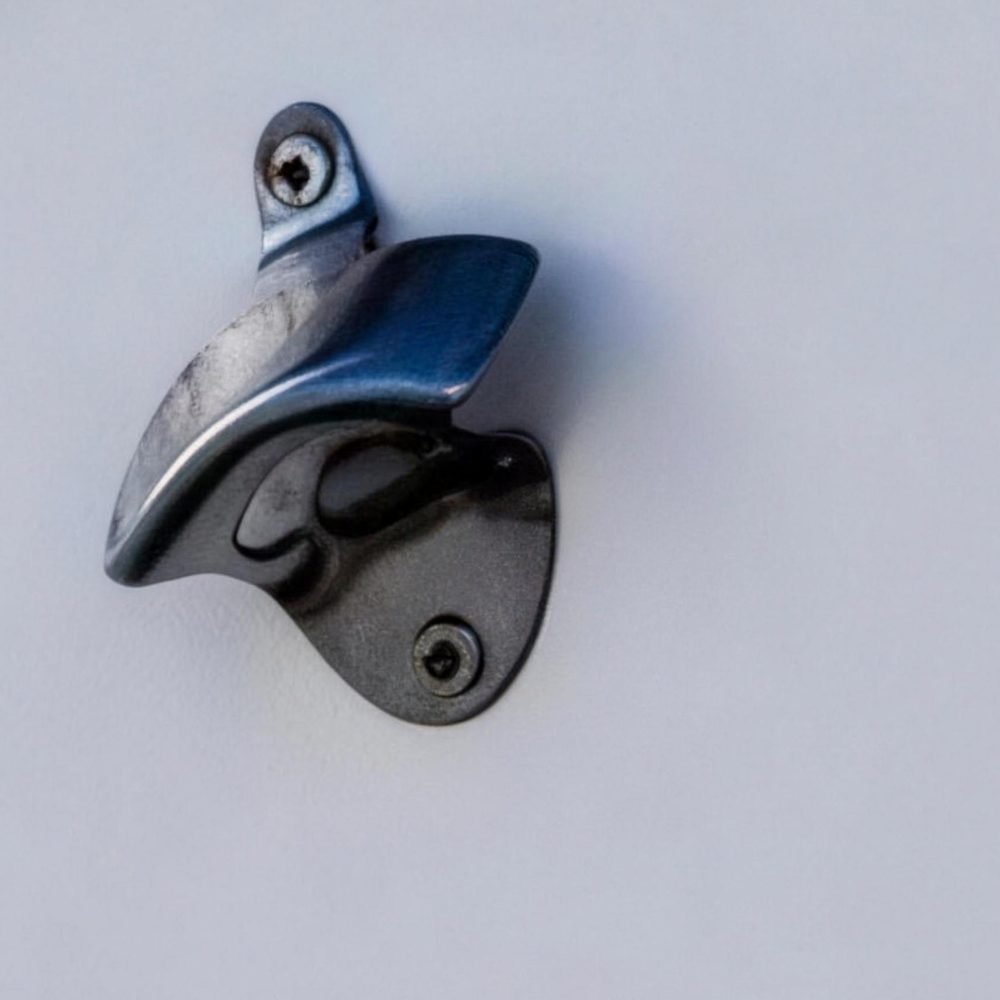 Frigid Rigid stainless bottle opener mounted on a chest lid