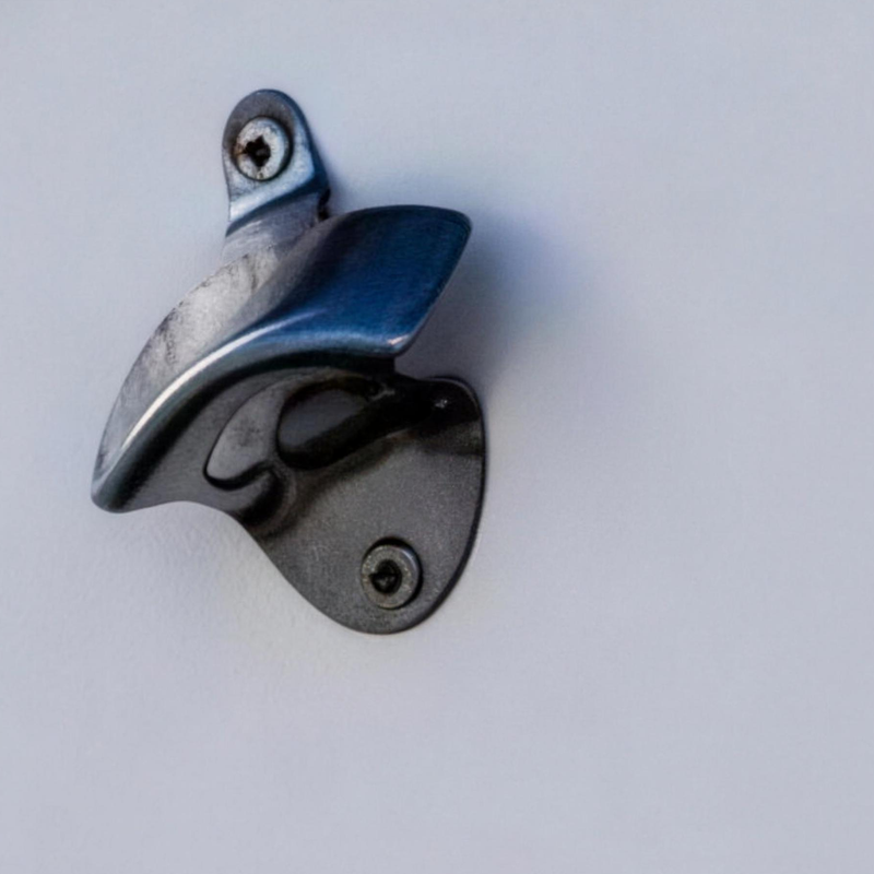 Frigid Rigid stainless bottle opener mounted on a chest lid